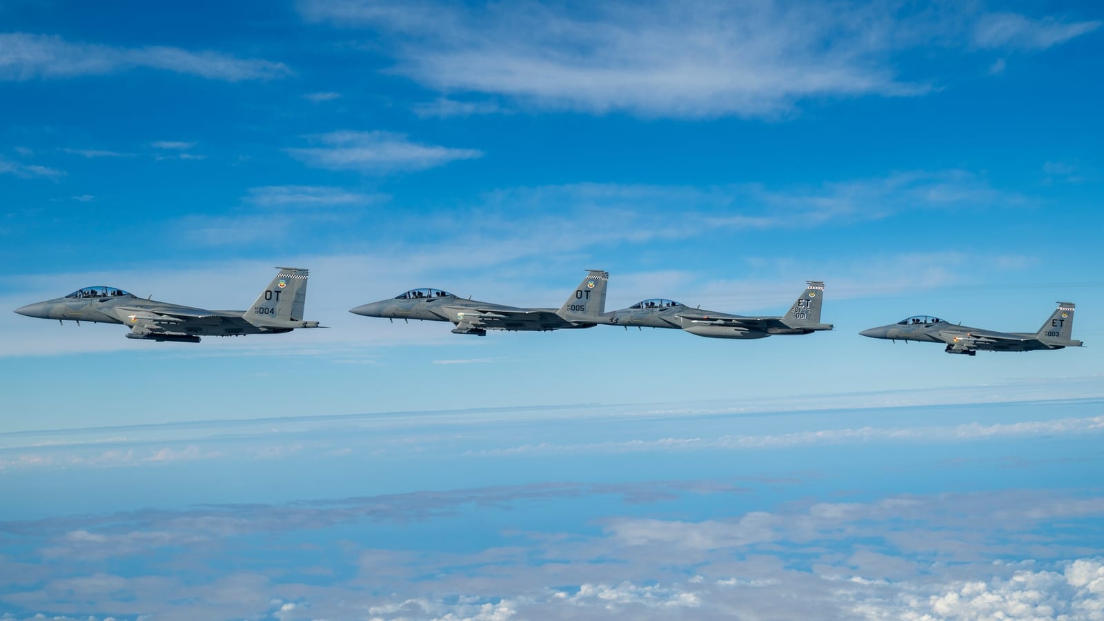 Four F-15EX Eagle II fighters from Eglin AFB in formation over the Gulf of Mexico