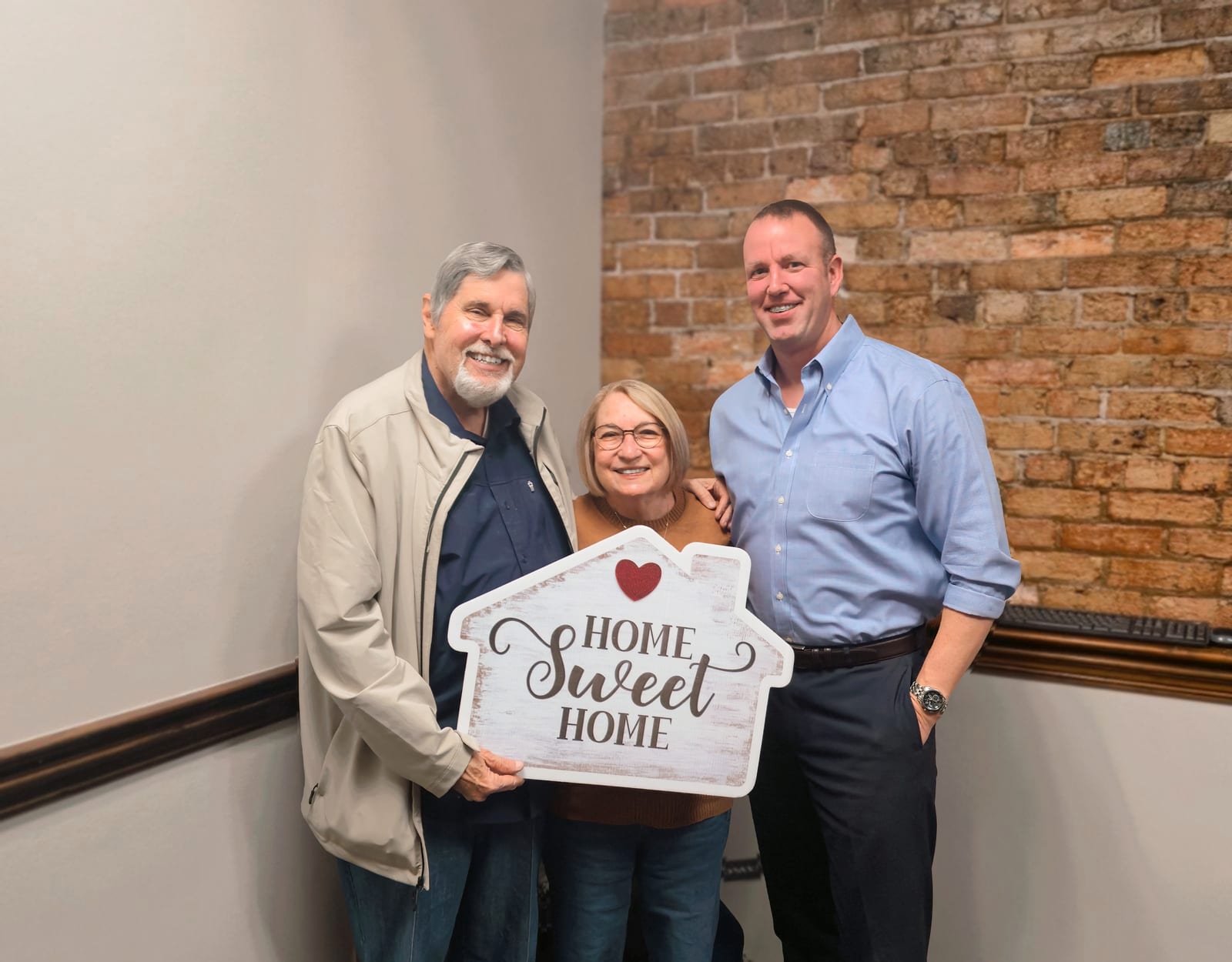 Gregg Costin with clients on closing day