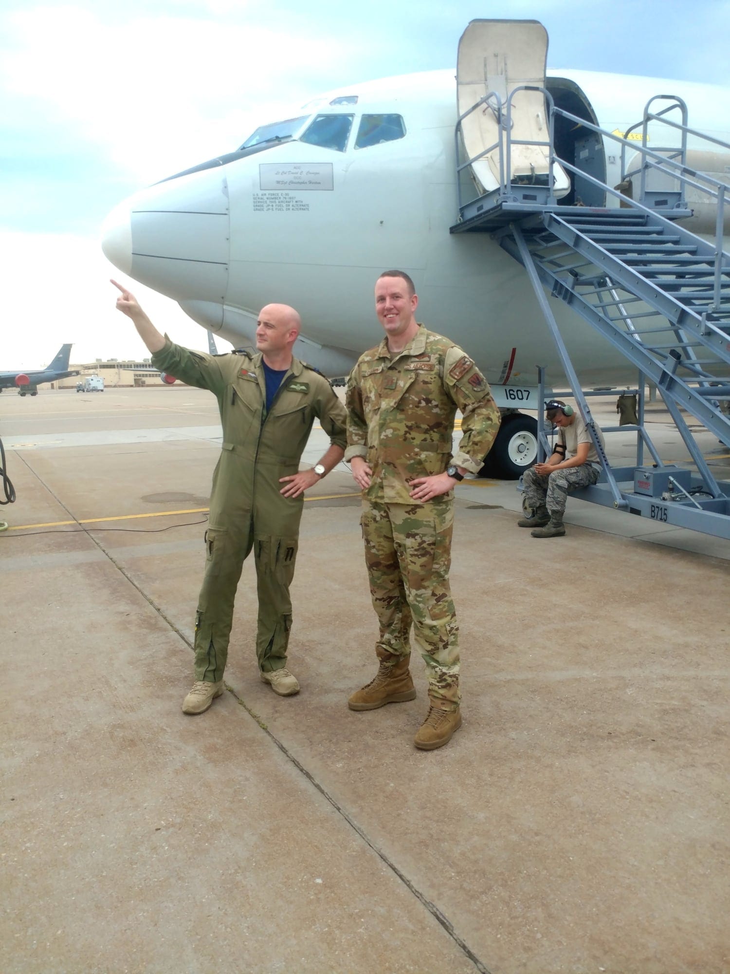 Airmen in OCPs walking the flightline